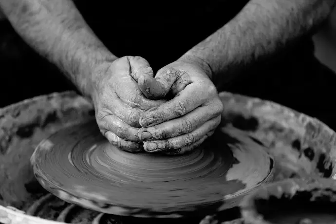 person making pot